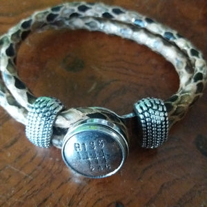 Leather bracelet with gearshift button