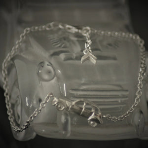 Silver elegant bracelet with car and chevron at the end